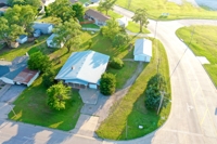 FOR SALE: 2130 N A Street, Wellington KS: 4 Bedrooms, 2 Baths, 2126 sf Brick Home w/48x24 Shed - $177,000 featured photo 1